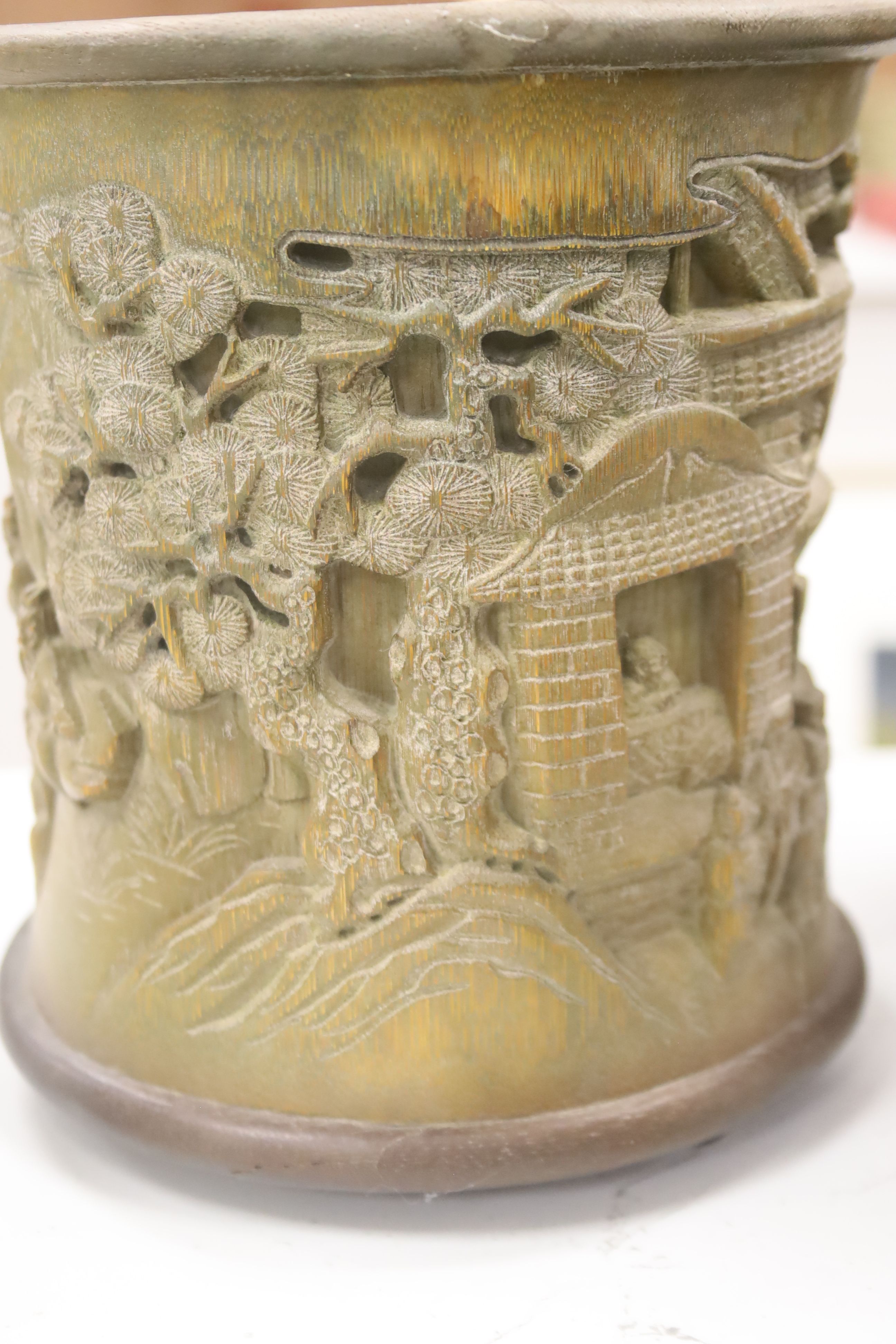 Six 19th/20th century Chinese carved brush pots and a similar carved tea caddy, tallest 20cm